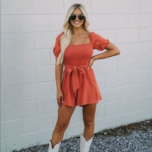 NWOT Burnt Orange Smocked Front Tie Romper